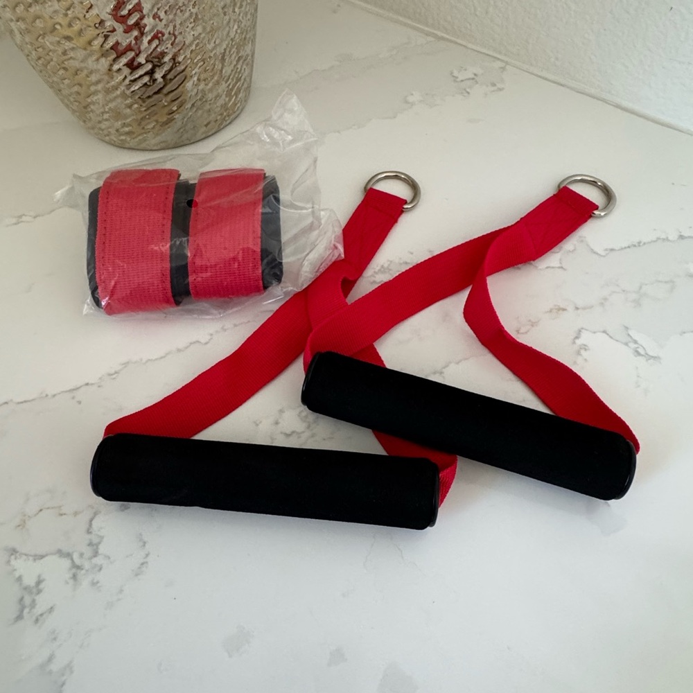 Exercise equipment. Brand new resistance band handles and straps. Sold as set